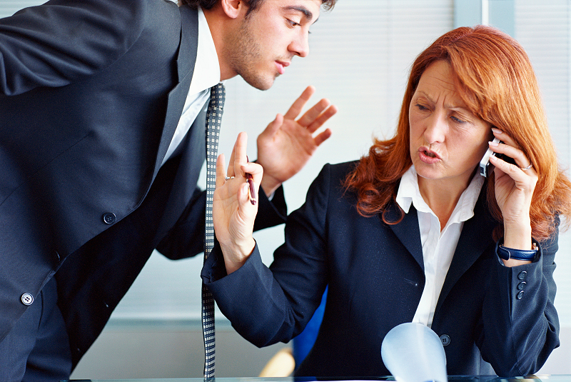 A person looking frustrated during a conversation.