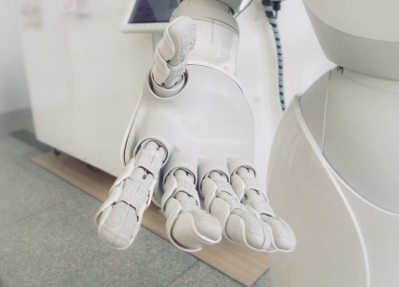 A modern home robot in action preparing coffee