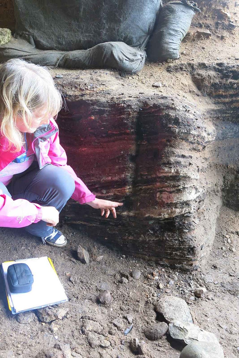 Archaeologist Cynthia Larbey examining early human sites