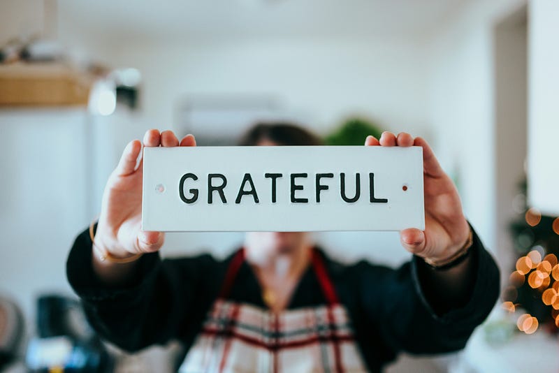 A notepad with gratitude listed.